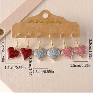 NIP set of 3 glittery heart shaped dangle earrings